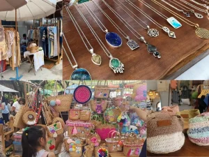 Barracas ao ar livre no Jing Jai Market vendendo produtos frescos e artesanato
